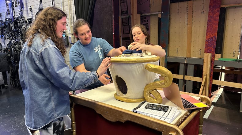 Springfield High School students oversee Chip's teacup, one of the props that will be featured in the Wildcat Theatre production of “Disney Beauty and the Beast, the Broadway Musical” at the John Legend Theater, Thursday through Saturday. Springfield City School District students will also be treated to a special performance and see the props and costumes this week.