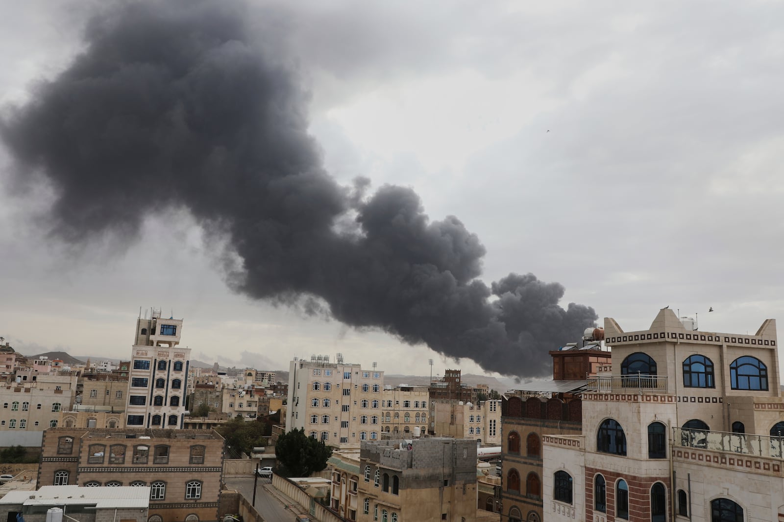 Smoke billows following Israeli airstrikes targeting a power plant and Sanaa Airport, in Sanaa, Yemen, Tuesday, May 5, 2025. (AP Photo/Osamah Abdulrahman)