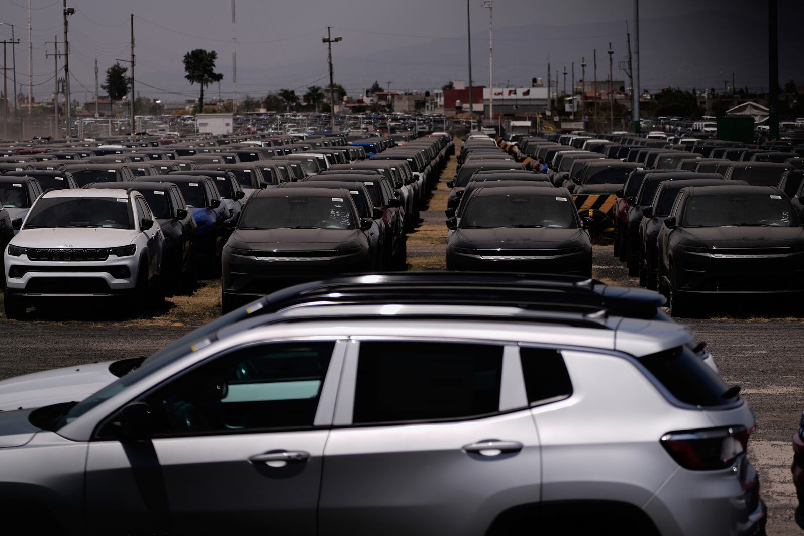 Cars are parked outside of the Stellantis car assembly plant in Mexico City, Thursday, April 3, 2025. (AP Photo/Marco Ugarte)