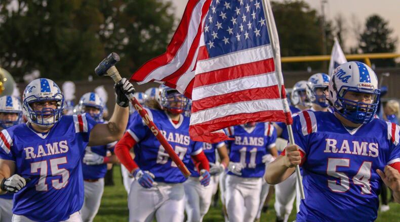 The Greeneview High School football team runs on to the field during their game against Catholic Central at Don Nock Field on Oct. 18. The Rams will travel to Cincinnati Madeira for a Division V, Region 20 quarterfinal game at 7 p.m. Saturday night. CONTRIBUTED PHOTO BY MICHAEL COOPER