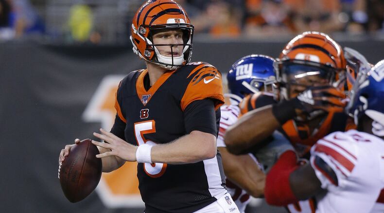 FILE - In this Aug. 22, 2019, file photo, Cincinnati Bengals quarterback Ryan Finley (5) looks to pass during the first half of an NFL preseason football game against the New York Giants, in Cincinnati. The winless Bengals benched Andy Dalton heading into their bye week, ending his nine-season run as starter so they can start developing rookie Ryan Finley as his potential long-term replacement. The move came two days after a 24-10 loss to the Rams in London left Cincinnati 0-8 for the first time in 11 years. (AP Photo/Frank Victores, File)