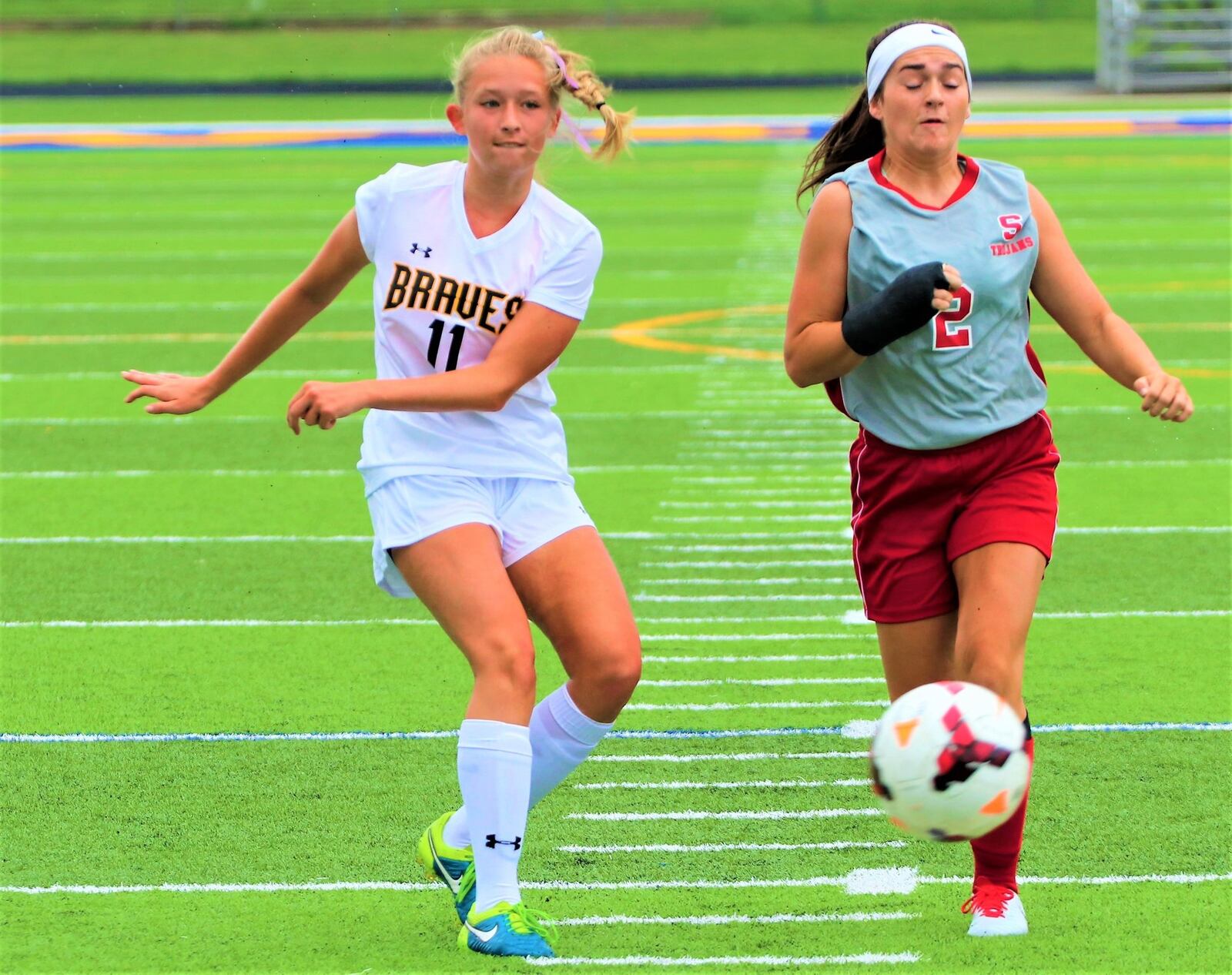 Shawnee High School senior Lena Jenssen (11) dribbles the ball through the Southeastern defense during the first annual Clark County Soccer Preview on Aug. 12 at Evans Stadium in Springfield. Jenssen is the top returning scorer in the Central Buckeye Conference this season, tallying 71 points last season. MICHAEL COOPER / CONTRIBUTED
