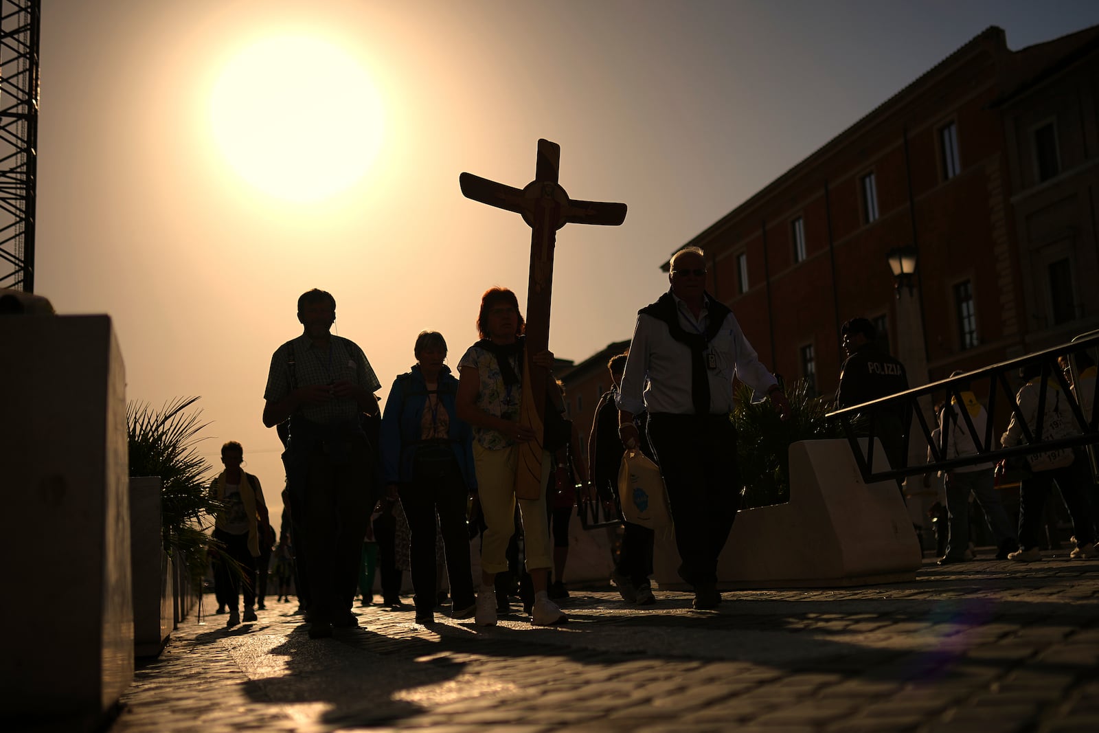 Pilgrims arrive in St. Peter's Square at the Vatican, Tuesday, April 22, 2025. (AP Photo/Francisco Seco)