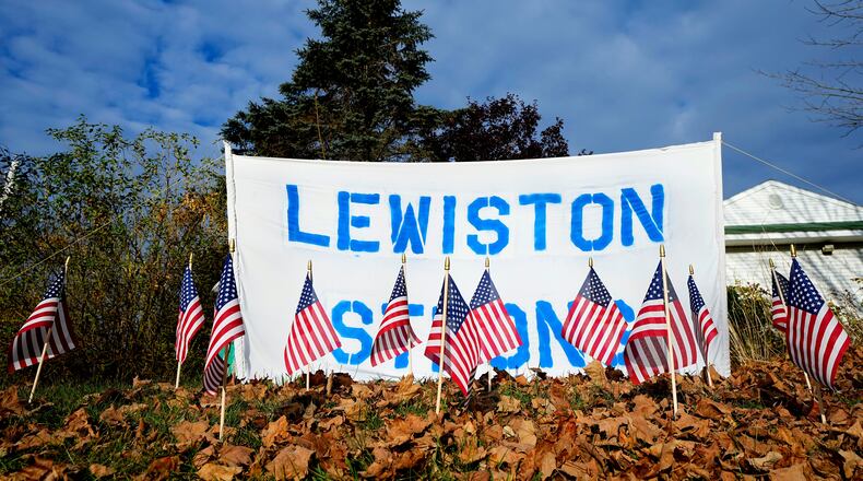 FILE - A make-shift memorial lines Main Street following a deadly mass shooting in Maine, Nov. 3, 2023, in Lewiston, Maine. (AP Photo/Matt York, File)