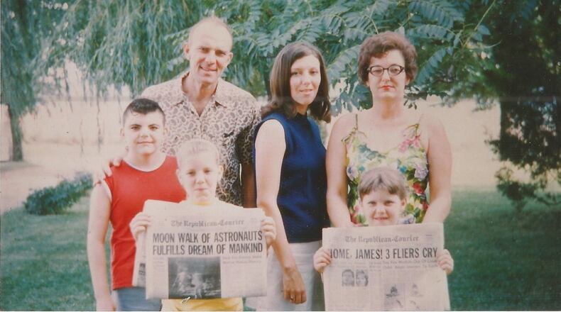 Pam Cottrel, at age 19, and her family pose with newspapers documenting U.S. astronauts landing on the moon. CONTRIBUTED