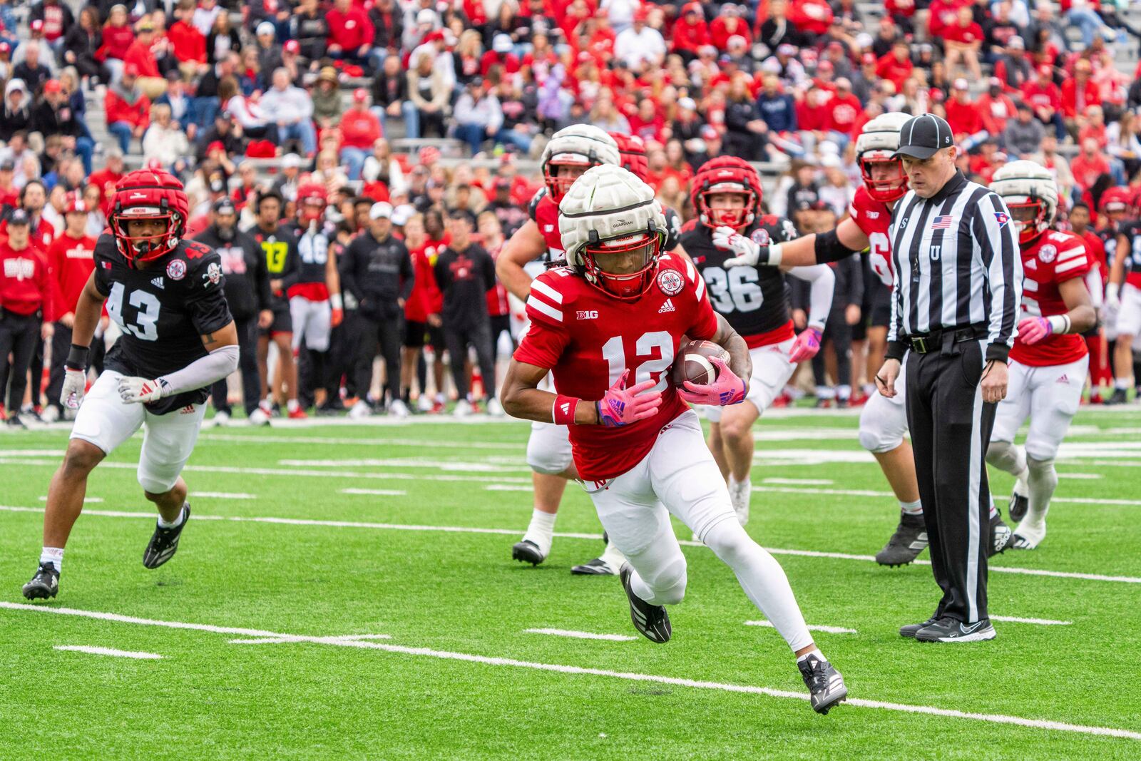 Nebraska wide receiver Jaidyn Doss (12) runs after a catch for a touchdown during an NCAA college football practice Saturday, April 26, 2025, in Lincoln, Neb. (AP Photo/Dylan Widger)