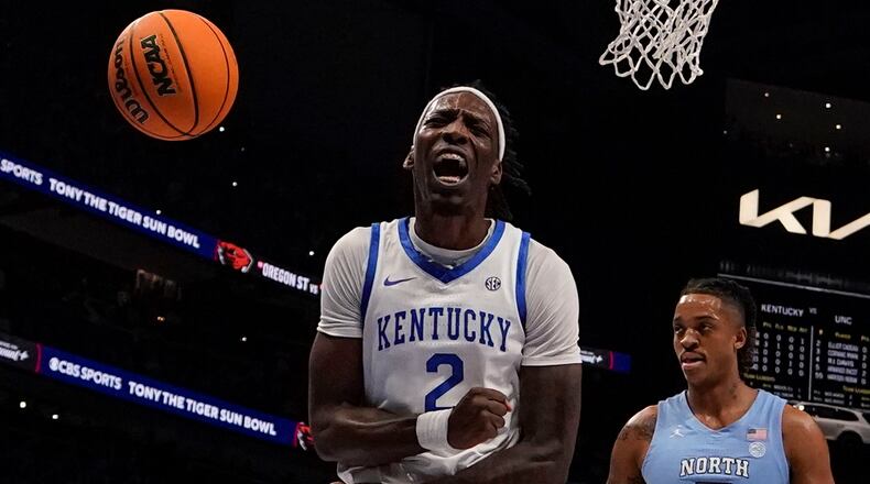 Kentucky forward Aaron Bradshaw (2) celebrates after scoring during the first half of an NCAA college basketball game against North Carolina in the CBS Sports Classic, Saturday, Dec. 16, 2023, in Atlanta, Ga. (AP Photo/Brynn Anderson)