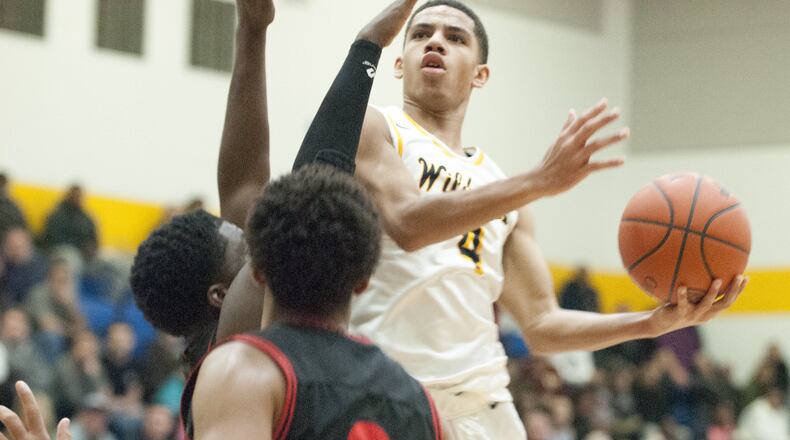 Springfield point guard David Sanford drives against the Wayne defense during the Wildcats’ 72-58 victory on Jan. 11, 2019. Sanford helped lead the Wildcats with 17 points. Jeff Gilbert/CONTRIBUTED