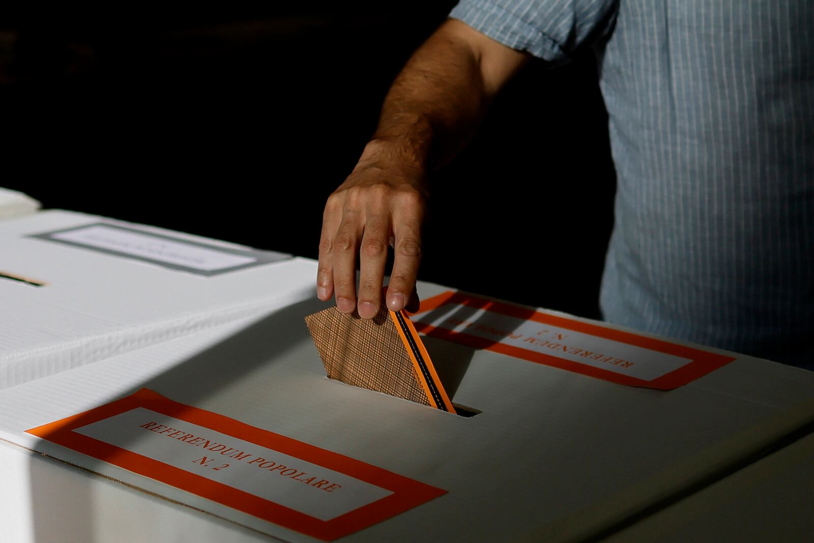 A man casts his ballot on referendums on citizenship and job protections, at a polling station in Rome, Sunday, June 8, 2025. (Cecilia Fabiano/LaPresse via AP)
