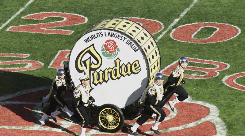 PASADENA, CA - JANUARY 1: Members of the Purdue Boilermakers band pull the World's Largest Drum on the field during halftime of the game against the Washington Huskies on January 1, 2001 at the Rose Bowl in Pasadena, California. Washington defeated Purdue 34-24. (Photo by Donald Miralle/Getty Images)