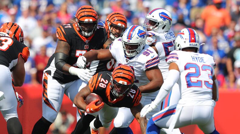 ORCHARD PARK, NY - SEPTEMBER 22: Ed Oliver #91 of the Buffalo Bills makes a tackle on Joe Mixon #28 of the Cincinnati Bengals as he runs the ball during the first quarter at New Era Field on September 22, 2019 in Orchard Park, New York. (Photo by Timothy Ludwig/Getty Images)