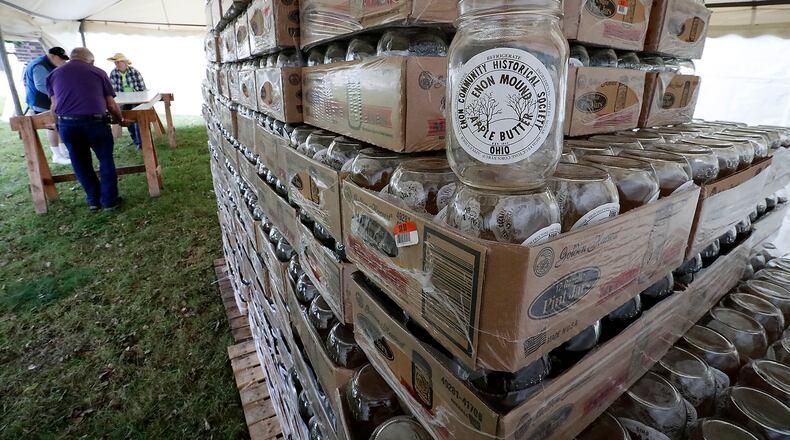 Over 4,600 mason jars wait to be filled with apple butter last weekend as workers set-up for the Apple Butter Festival in Enon several years ago. Bill Lackey/Staff