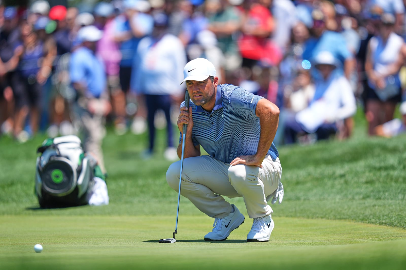 Scottie Scheffler prepares to putt on the first hole during the final round of the CJ Cup Byron Nelson golf tournament in McKinney, Texas, Sunday, May 4, 2025. (AP Photo/LM Otero)