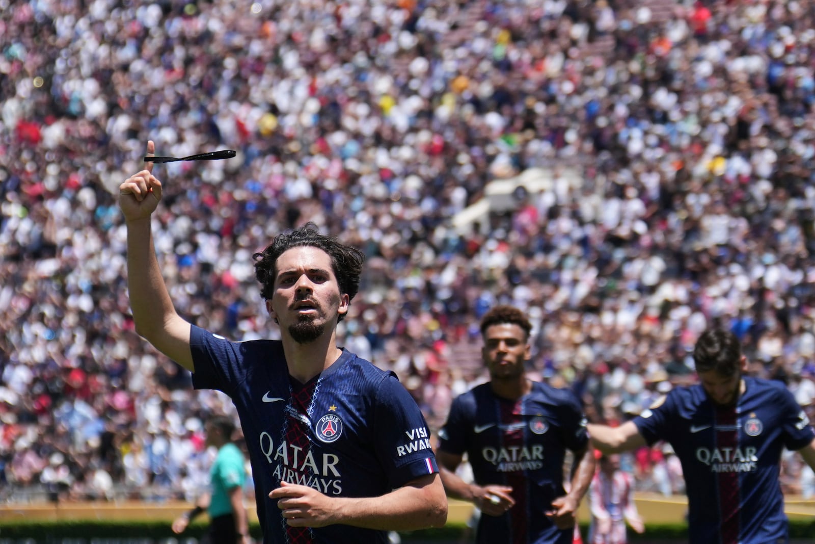 Paris Saint-Germain's Vitinha celebrates scoring his side's second goal during the Club World Cup group B soccer match between PSG and Atletico Madrid in Pasadena, Calif., Sunday, June 15, 2025. (AP Photo/Jae Hong)