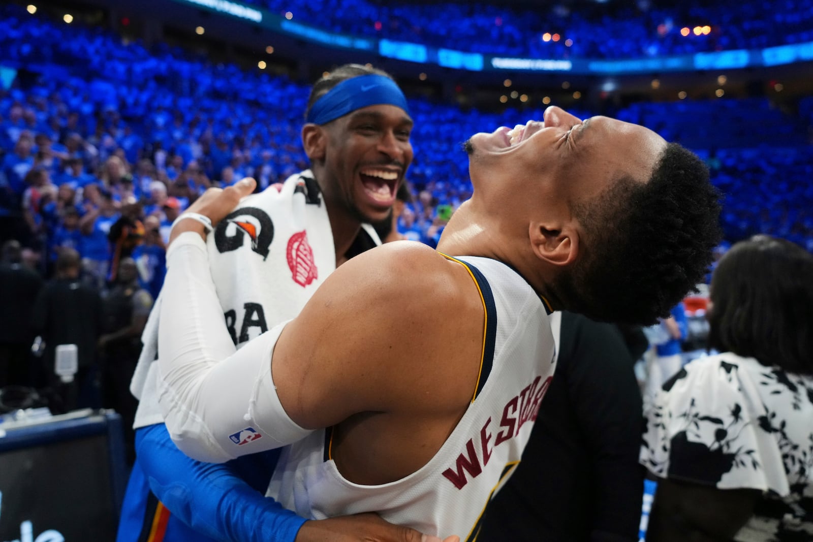 Denver Nuggets' Russell Westbrook, right, talks with Oklahoma City Thunder's Shai Gilgeous-Alexander, left, after Game 7 in the Western Conference semifinals of the NBA basketball playoffs, Sunday, May 18, 2025, in Oklahoma City. (AP Photo/Kyle Phillips)