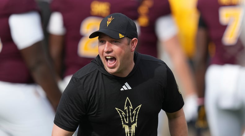 Arizona State head coach Kenny Dillingham encourages his players prior to an NCAA college football game against West Virginia Saturday, Nov. 15, 2025, in Tempe, Ariz. (AP Photo/Ross D. Franklin)
