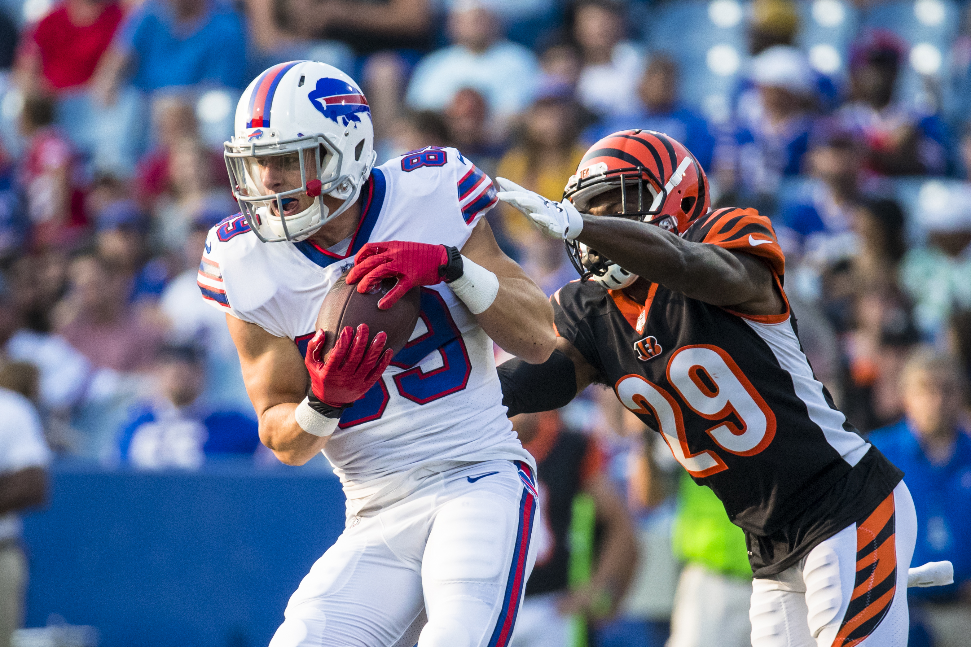 ORCHARD PARK, NY - AUGUST 26: Brandon Reilly #89 of the Buffalo Bills makes a first down reception as Tony McRae #29 of the Cincinnati Bengals defends during the fourth quarter of a preseason game at New Era Field on August 26, 2018 in Orchard Park, New York. Cincinnati defeats Buffalo 26-13 in the preseason matchup. (Photo by Brett Carlsen/Getty Images)