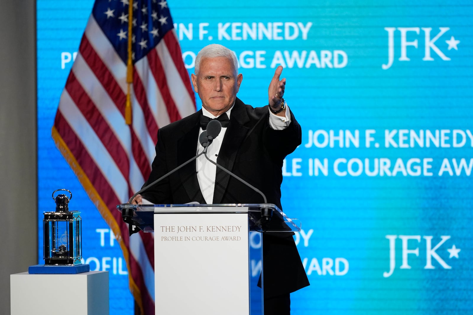Former Vice President Mike Pence acknowledges his staff members as he speaks after receiving the John F. Kennedy Profile in Courage Award during a ceremony at the JFK Library, Sunday, May 4, 2025, in Boston. (AP Photo/Robert F. Bukaty)
