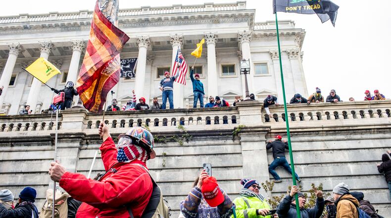 Americans watched on Jan. 6 as President Donald Trump’s supporters stormed the U.S. Capitol, prompting a lockdown and disrupting Congress as they met to vote to approve the Electoral College’s vote. FILE