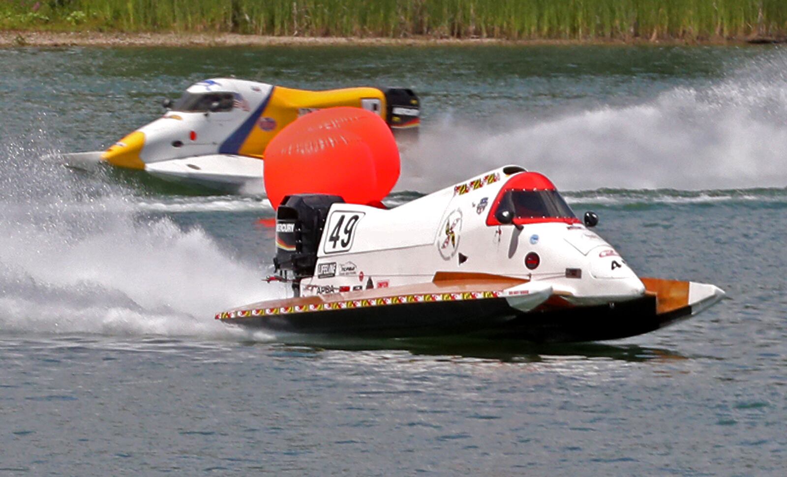 Formula 2 boat racers practice at Champions Park Lake Friday as they prepare for Wake the Lake 4 this weekend. BILL LACKEY/STAFF