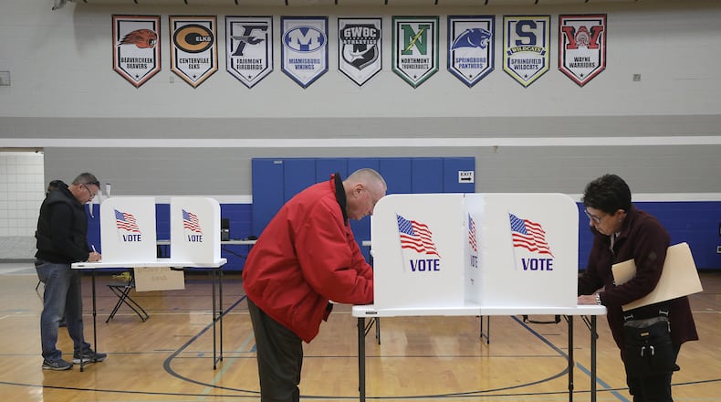 Voters fill out their ballots Tuesday at Roosevelt Middle School in the City of Springfield. BILL LACKEY/STAFF