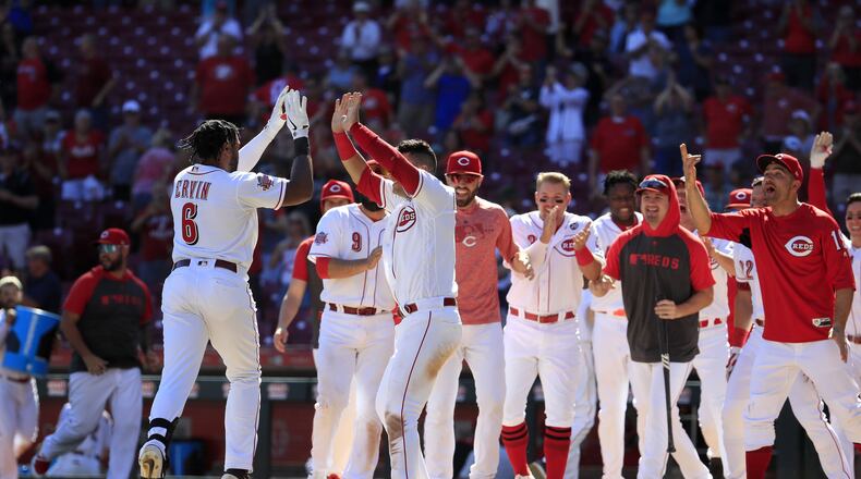 CINCINNATI, OHIO - SEPTEMBER 05: Phillip Ervin #6 of the Cincinnati Reds celebrates with Jose Iglesias #4 after hitting the game winning home run in the 11th inning against the Philadelphia Phillies at Great American Ball Park on September 05, 2019 in Cincinnati, Ohio. (Photo by Andy Lyons/Getty Images)