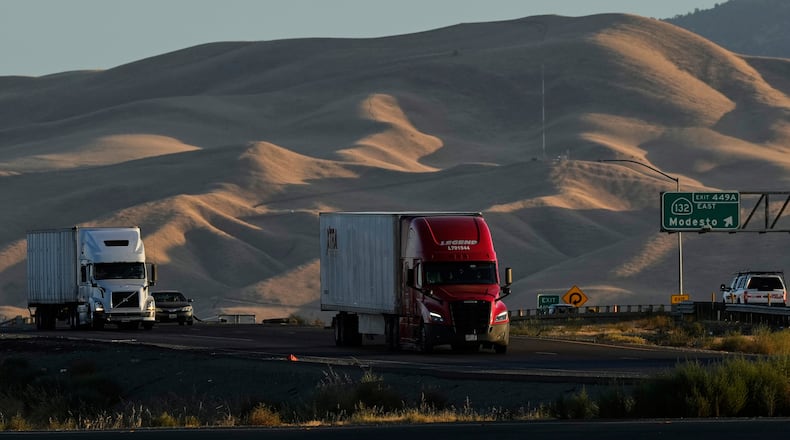 FILE - Freight trucks travel northbound on Interstate 5 Highway, Wednesday, Sept. 3, 2025, in Tracy, Calif. (AP Photo/Godofredo A. Vásquez, File)