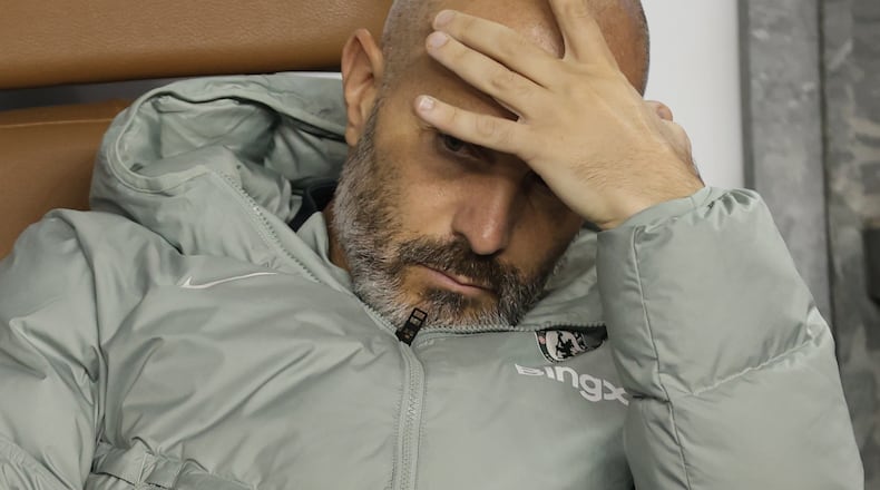 FILE - Chelsea's head coach Enzo Maresca sits on a bench ahead of the Champions League opening phase soccer match between Qarabag and Chelsea in Baku, Azerbaijan, on Nov. 5, 2025. (AP Photo, File)