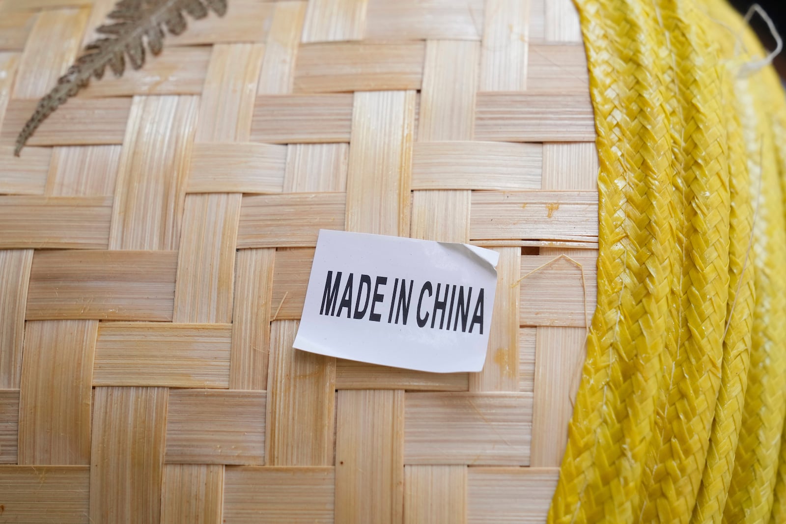 FILE - A made in China sticker is displayed on a hat at a store in Chinatown in San Francisco, April 18, 2025. (AP Photo/Jeff Chiu, File)