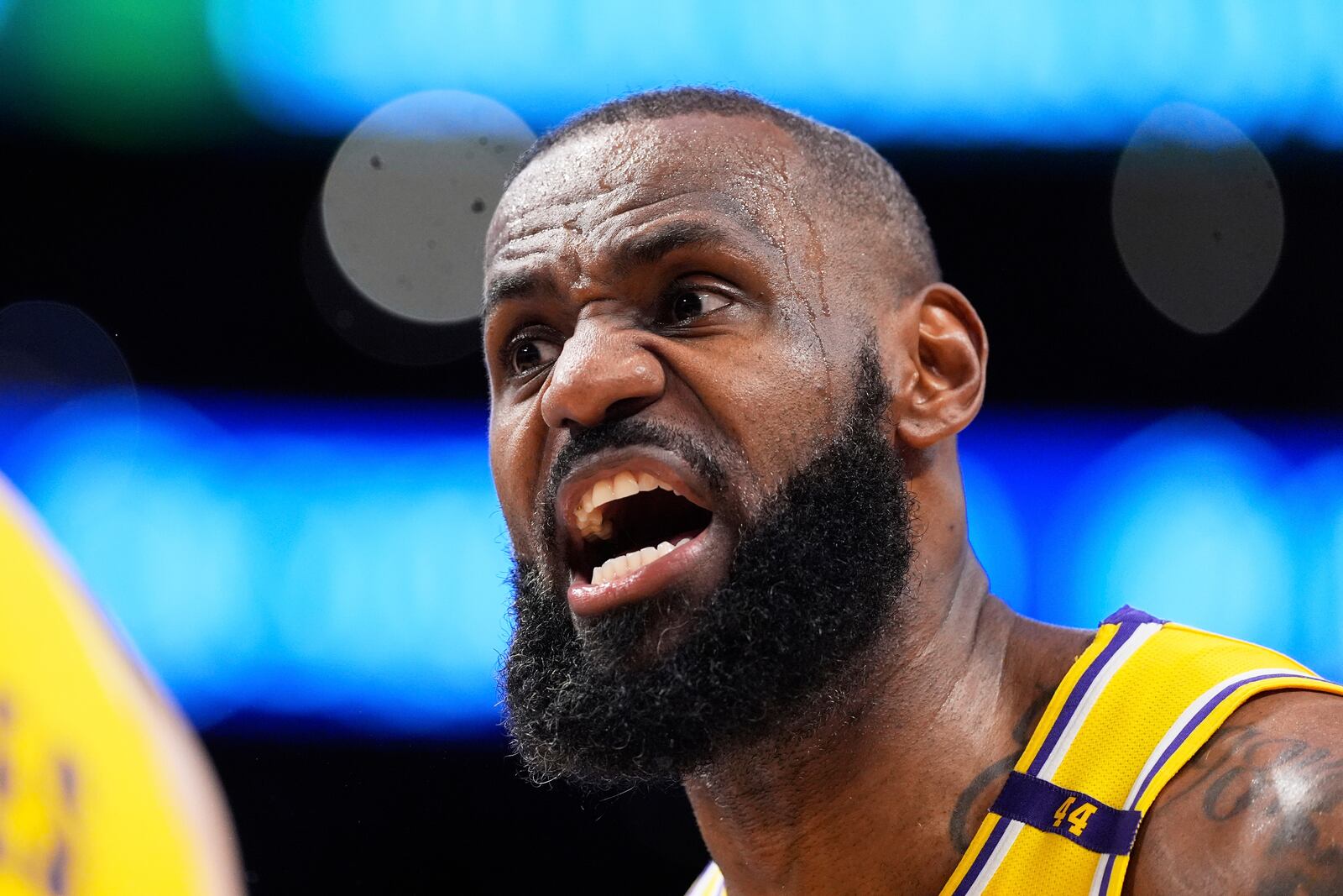 Los Angeles Lakers forward LeBron James yells at a referee during the first half of an NBA basketball game against the Golden State Warriors Thursday, April 3, 2025, in Los Angeles. (AP Photo/Mark J. Terrill)