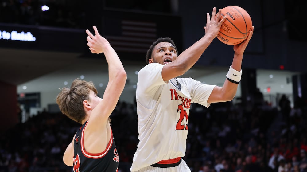 Trotwood-Madison junior guard Darius Dennis shoots with pressure from Steubenville's Landon Bowers during the Division III state final on Friday, March 20 at University of Dayton Arena. Dennis had nine points at halftime, when the Rams led 25-19. BRYANT BILLING / STAFF