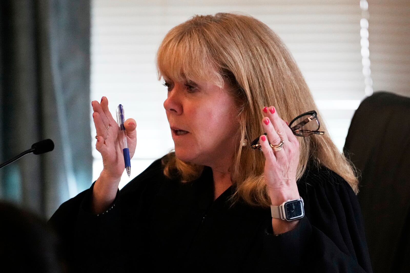 Judge Beverly Cannone talks with defense attorney Robert Alessi during the Karen Read trial at Norfolk Superior Court, Thursday, June 12, 2025, in Dedham, Mass. (AP Photo/Charles Krupa, Pool)