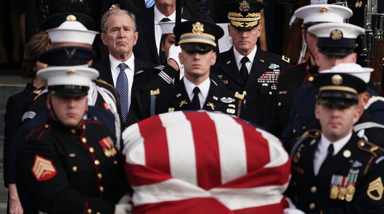 Former U.S. President George W. Bush follows the joint service honor guard carrying the casket of his father, former US President George H.W. Bush, to an awaiting hearse after his state funeral at the Washington National Cathedral on December 5, 2018 in Washington, D.C. (Photo by Alex Wong/Getty Images)