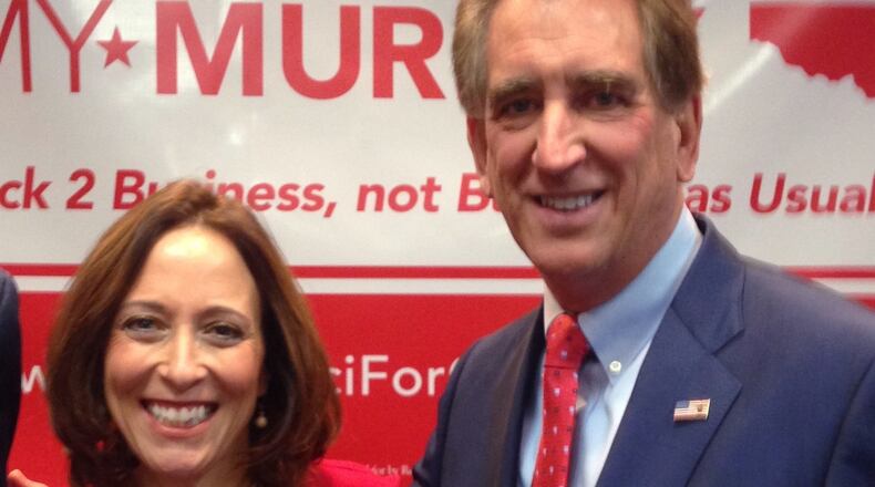 Republican congressman Jim Renacci introduces Cincinnati councilwoman Amy Murray as his running mate for the 2018 Ohio governor primary, Monday, Dec. 11, 2017, in Cincinnati. (AP Photo/Dan Sewell)