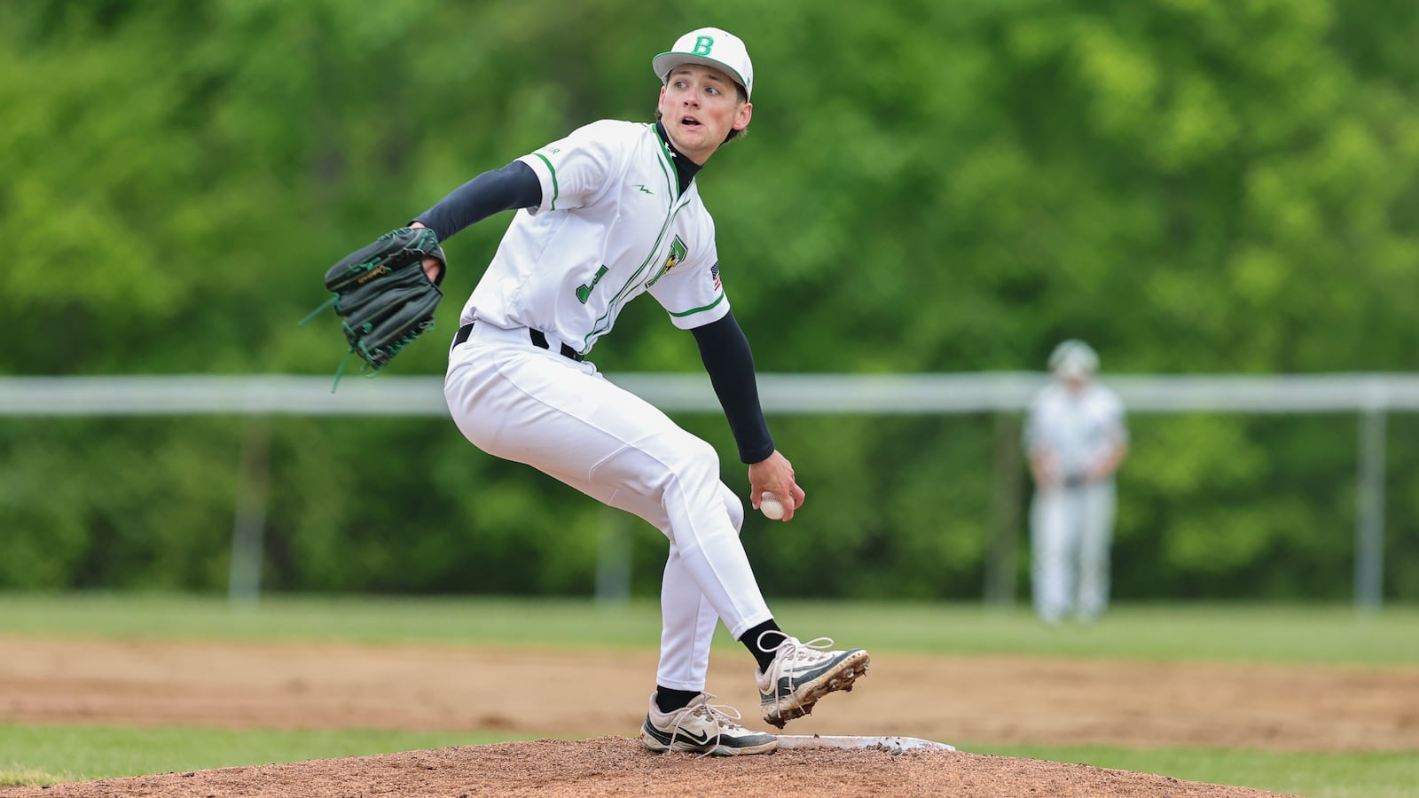 Bethel High School senior Christian Barker delivers a pitch to the plate during their Division IV tournament game against Shawnee on Wednesday, May 21. The Braves won 4-1. MICHAEL COOPER / STAFF