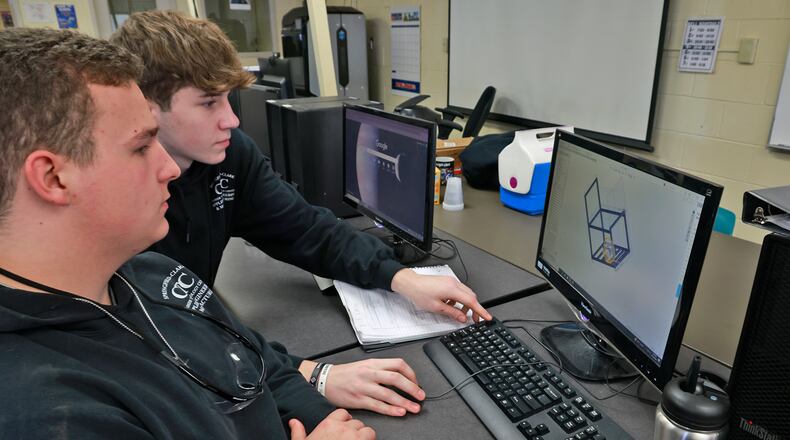 Daniel Bowers, senior, Springfield High School, and Caleb Ricketts, senior, Northeastern High School, work on a computer aided design project in the Applied Engineering & Manufacturing program Friday, Oct. 18, 2024. BILL LACKEY/STAFF