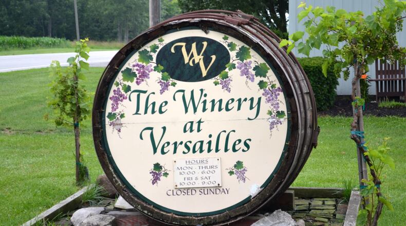 The wine-cask sign in front of the Winery at Versailles. Staff photo by Mark Fisher