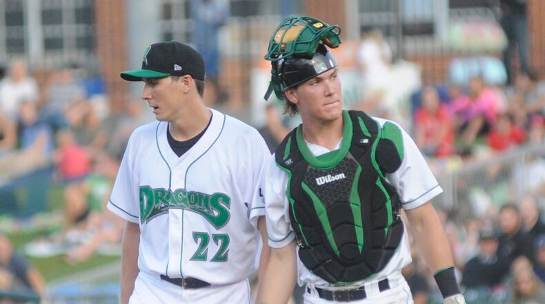 Homer Bailey (left) and Dragons catcher Tyler Stephenson huddle on the mound during a 4-3 defeat of the visiting Great Lakes Loons at Dayton’s Fifth Third Field on Wednesday, June 14, 2017. MARC PENDLETON / STAFF