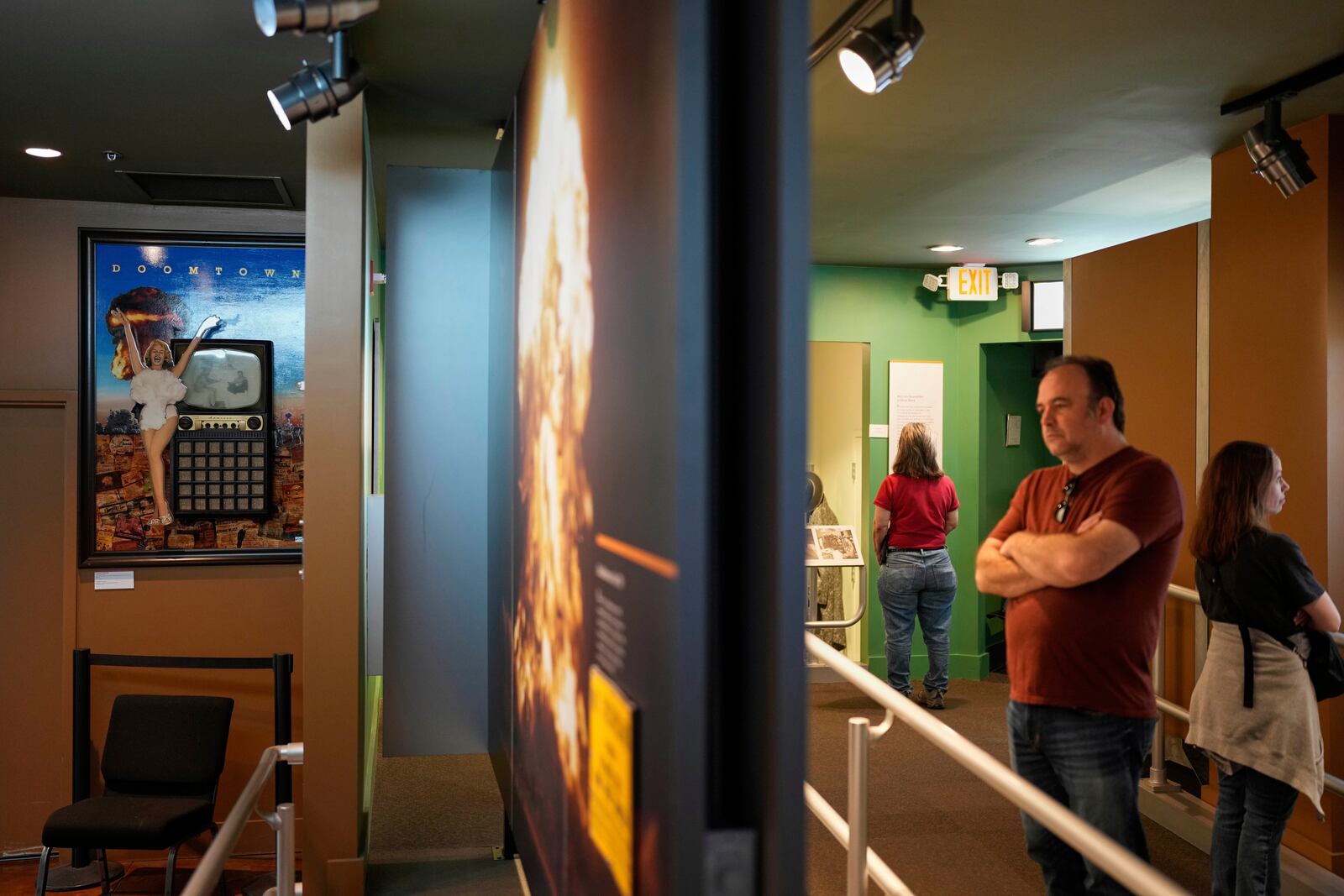 An artwork referencing the Miss Atomic Bomb photo, left, is on display at the Atomic Museum, on April 16, 2025, in Las Vegas. (AP Photo/John Locher)