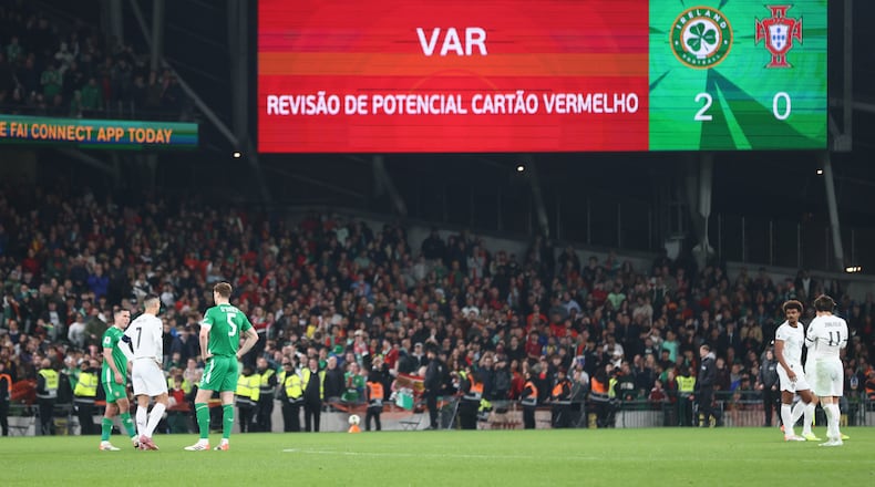 A VAR check on Portugal's Cristiano Ronaldo red card displays the decision was correct during a World Cup 2026 group F qualifying soccer match between Ireland and Portugal in Dublin, Thursday, Nov. 13, 2025. (AP Photo/Peter Morrison)