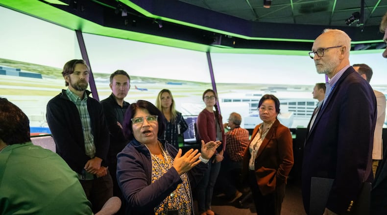 Savvy Verma, left, and Huy Tran, director of aeronautics at NASA’s Ames Research Center in California’s Silicon Valley, center, explain a recent air traffic management simulation to guests at Ames’ FutureFlight Central simulator on Sept. 26.
Credit: NASA/Jesse Carpenter