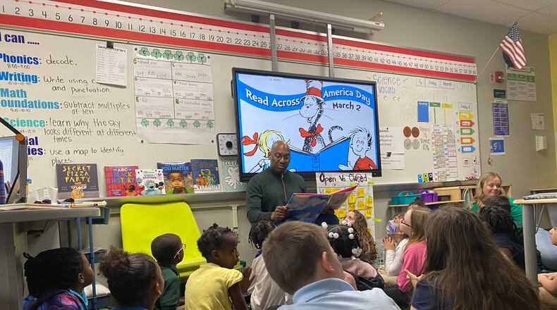 David Lawrence, Dayton Public Schools superintendent, reads to first-graders at Cleveland Elementary on Friday, March 1. Eileen McClory/ Staff