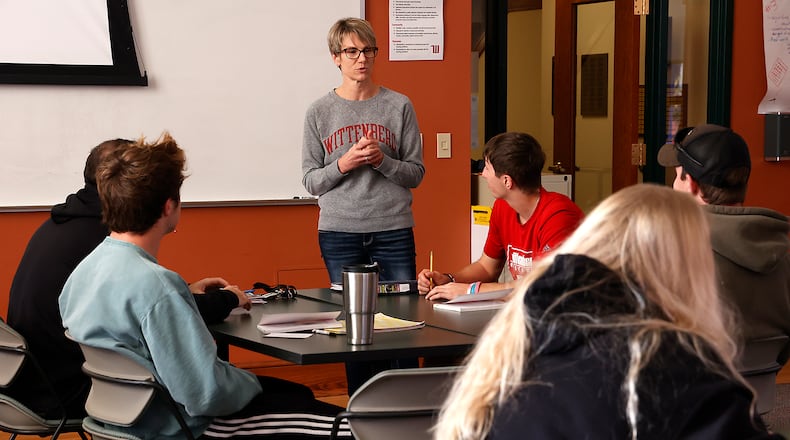 Wittenberg University has extended its new tuition-free program for eligible Ohio residents to include transfer students. Here, Amy McGuffey teaches a sociological perspectives of education class at Wittenberg University. BILL LACKEY/STAFF