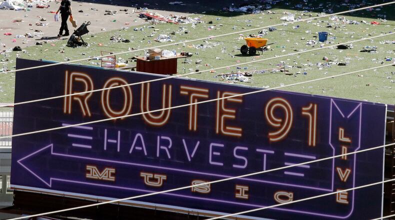 Investigators work the scene Monday, Oct. 2, 2017, after a mass shooting at a music festival near the Mandalay Bay resort and casino on the Las Vegas Strip on Sunday in Las Vegas. (AP Photo/Chris Carlson)