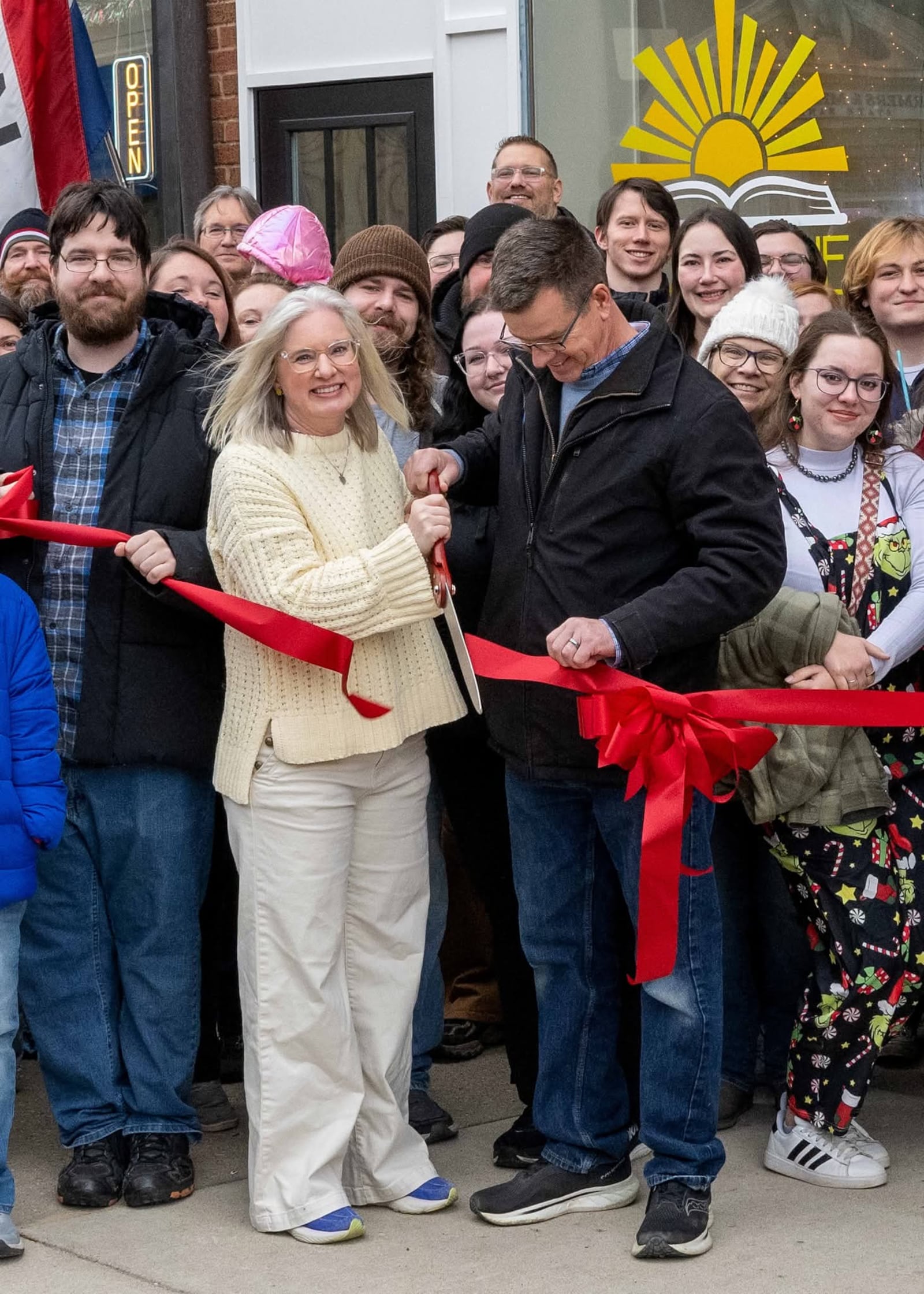 Christina Flowers and her husband, Don, opened Sunshine Book Nook at 111 N. Main St. in Urbana. The couple is pictured here during a recent ribbon-cutting ceremony held at the store. CONTRIBUTED