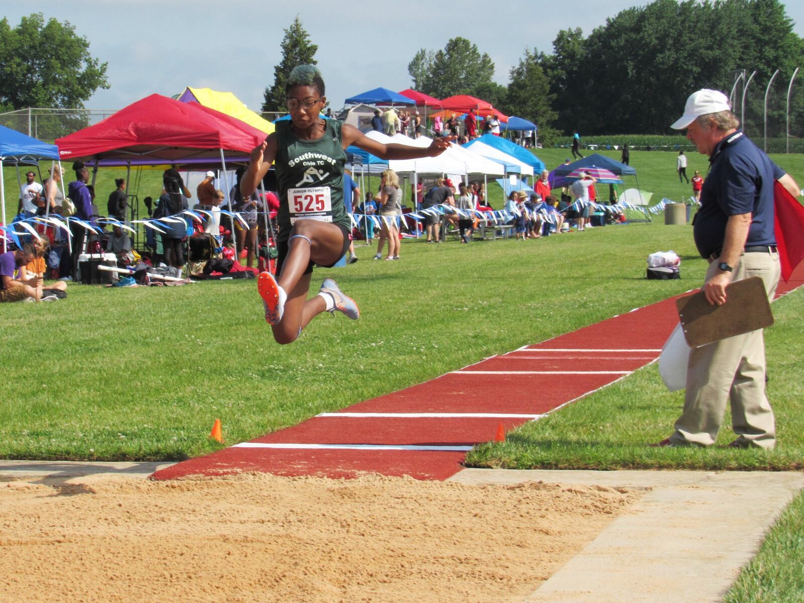 Malaya Booth competing in the long jump. CONTRIBUTED
