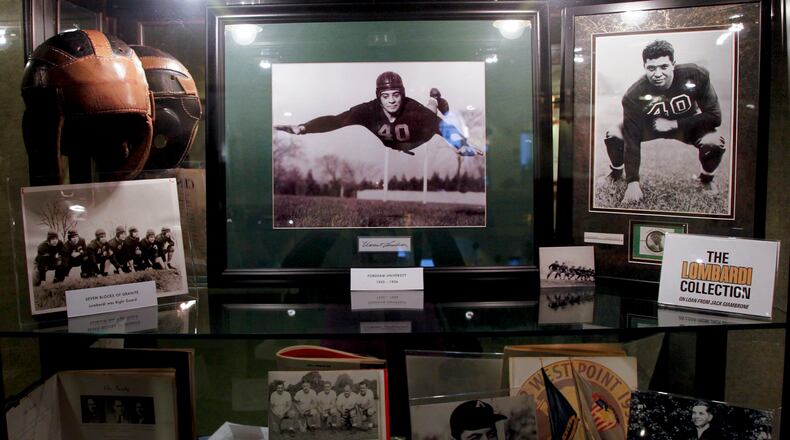 A collection of Vince Lombardi memorabilia from the Jack Giambrone collection is on display in the lobby of the Loft Theatre in downtown Dayton for the play "Lombardi." LISA POWELL / STAFF