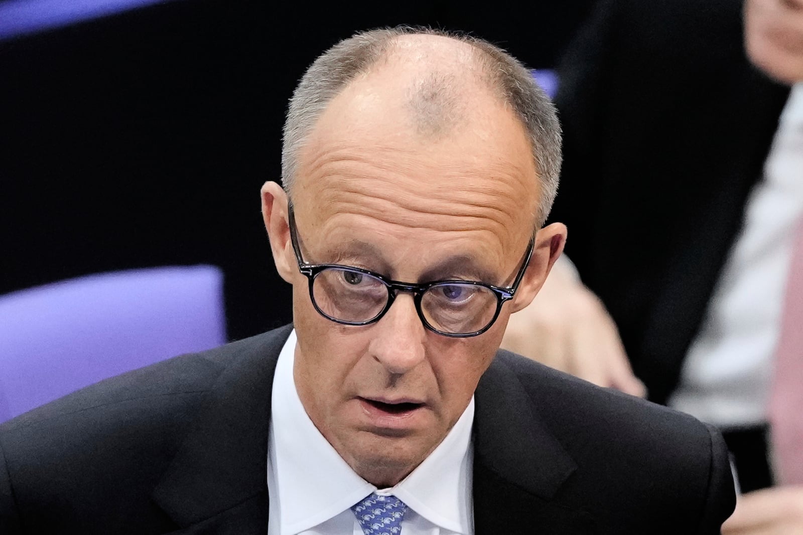 Friedrich Merz reacts after he was not elected new Chancellor in the first voting process at the parliament Bundestag in Berlin, Tuesday, May 6, 2025. (AP Photo/Markus Schreiber)