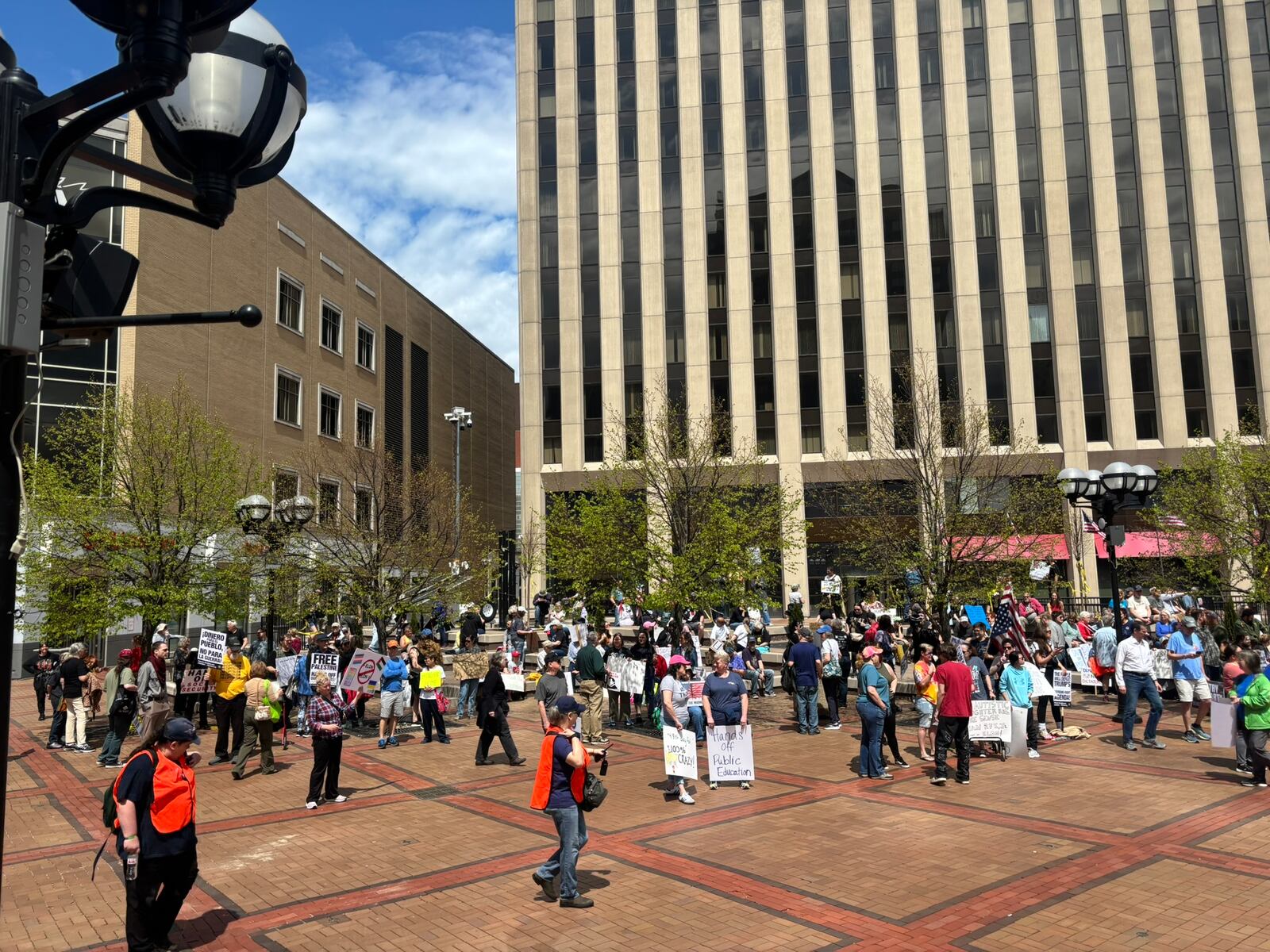 Protestors gather in Courthouse Square in downtown Dayton Saturday for a protest against President Donald Trump. Eileen McClory / staff