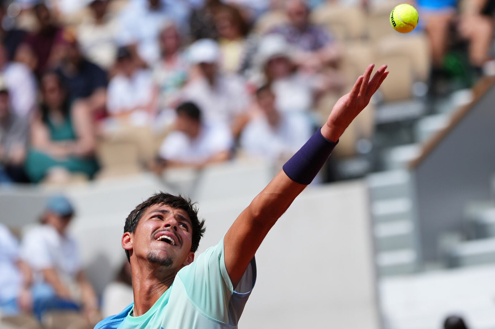 Australia's Alexei Popyrin serves against Tommy Paul of the U.S. during their fourth round match of the French Tennis Open, at the Roland-Garros stadium, in Paris, Sunday, June 1 2025. (AP Photo/Lindsey Wasson)